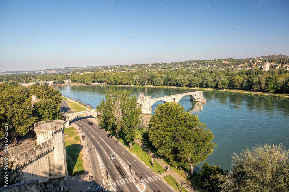 Avignon, famous bridge with Rhone river against blue sky in Provence, France
