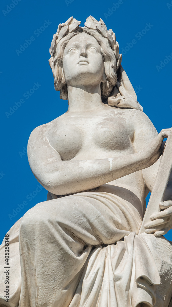 Statue of beautiful woman as musician and singer of State Opera fountain in Vienna, Austria, details, closeup.