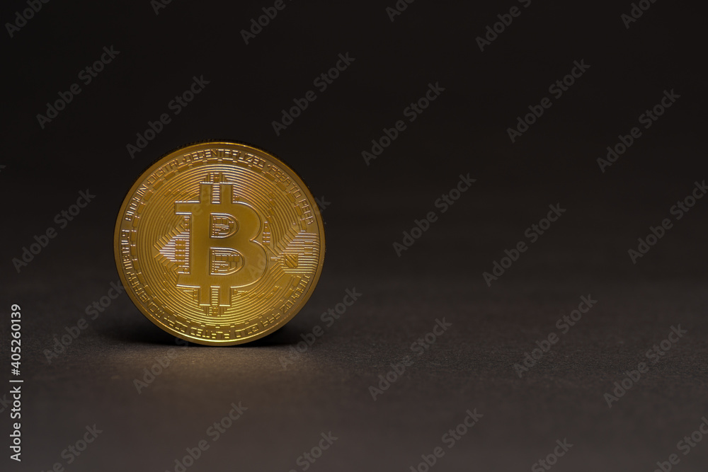 single golden shiny valuable bitcoin standing on a black background left single golden shiny valuable bitcoin standing on a black background left