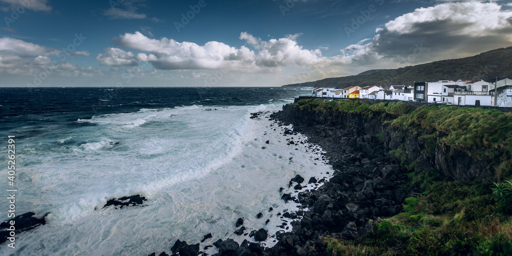 Colorful houses on the steep cliffs on Sao Miguel Azores Portugal