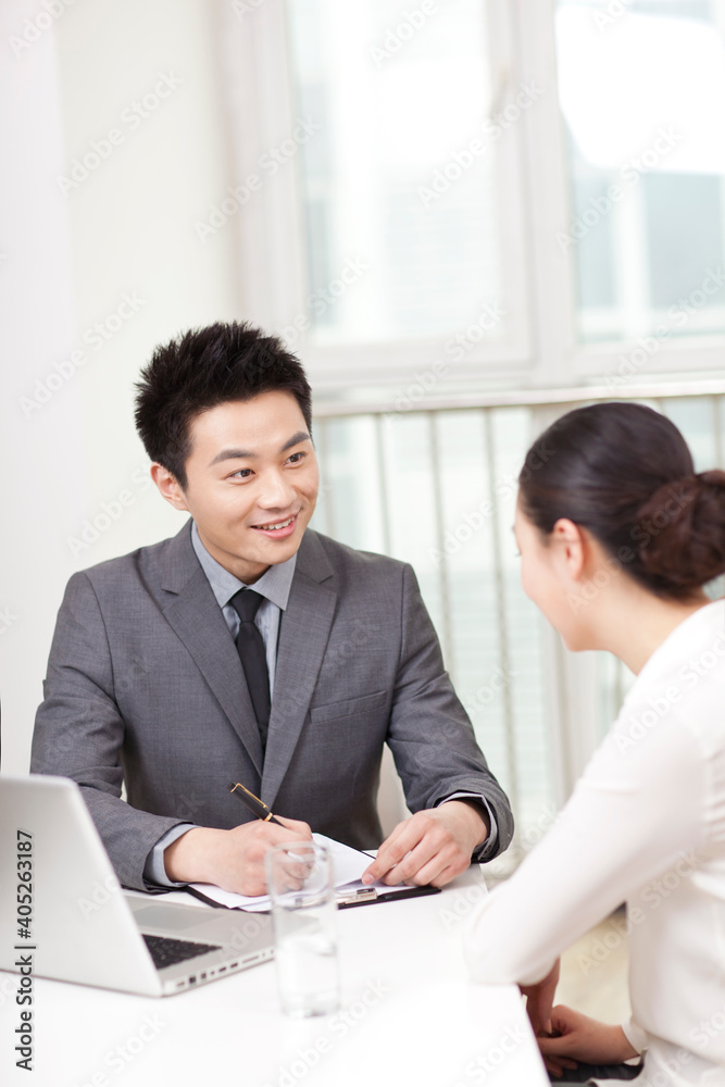 Group of business people discussing in office Group of business people discussing in office