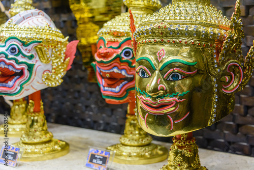 Traditional golden Thai masks for sale, Thailand © Stephen