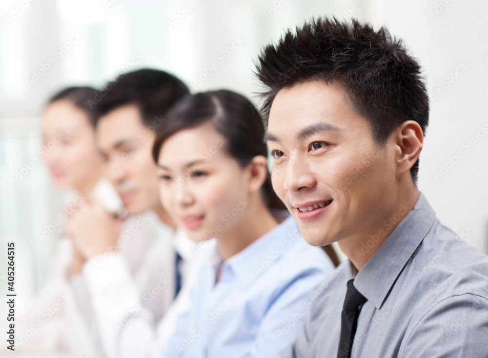 Group of business people sitting at conference table Group of business people sitting at conference table