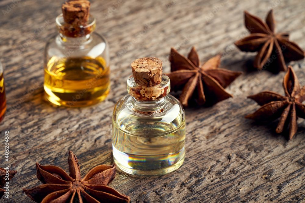 Essential oil bottle with star anise Essential oil bottle with star anise