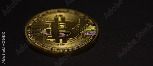single golden valuable bitcoin on black background panorama