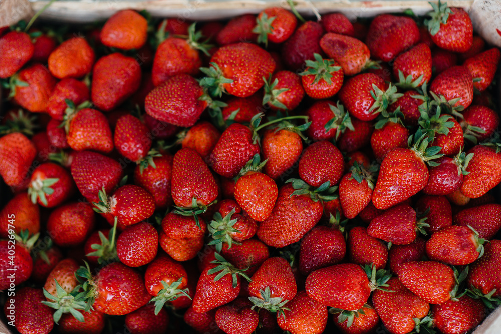 Ripe fresh strawberries close-up in a container for sale. Healthy diet Ripe fresh strawberries close-up in a container for sale. Healthy diet