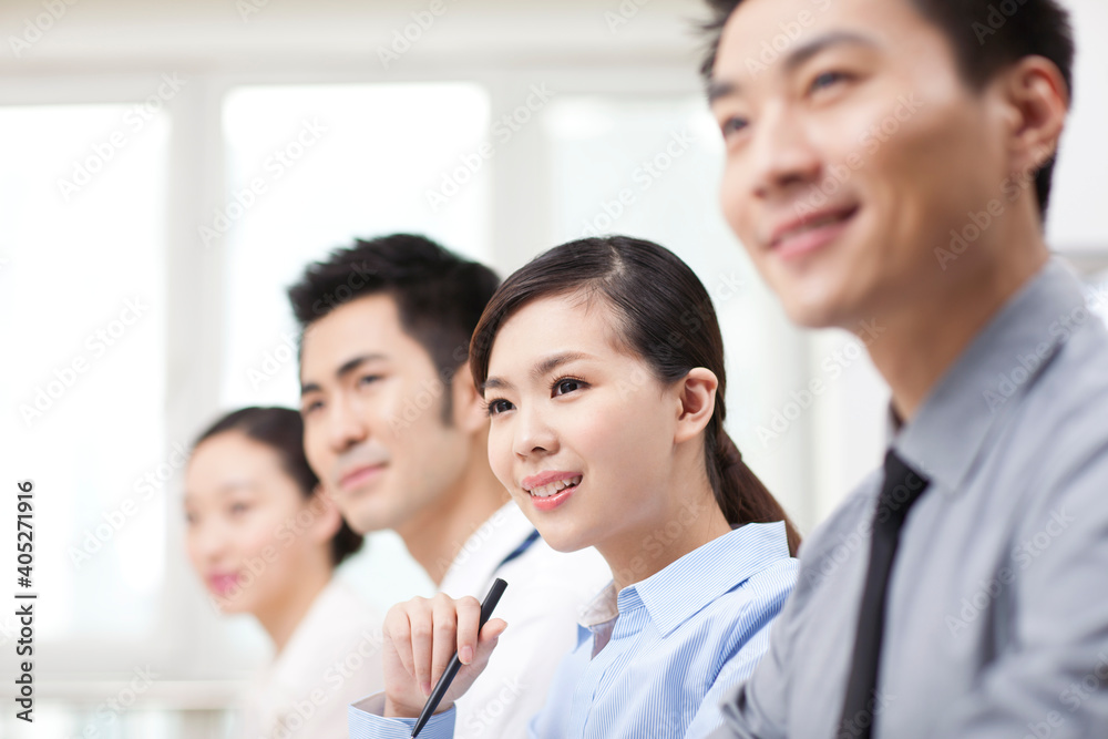 Group of business people sitting at conference table Group of business people sitting at conference table