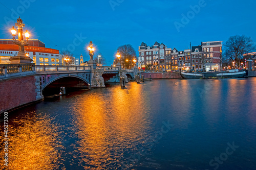 The Blauwbrug at the Amstel in Amsterdam the Netherlands at sunset