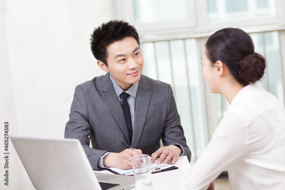 Group of business people discussing in office Group of business people discussing in office