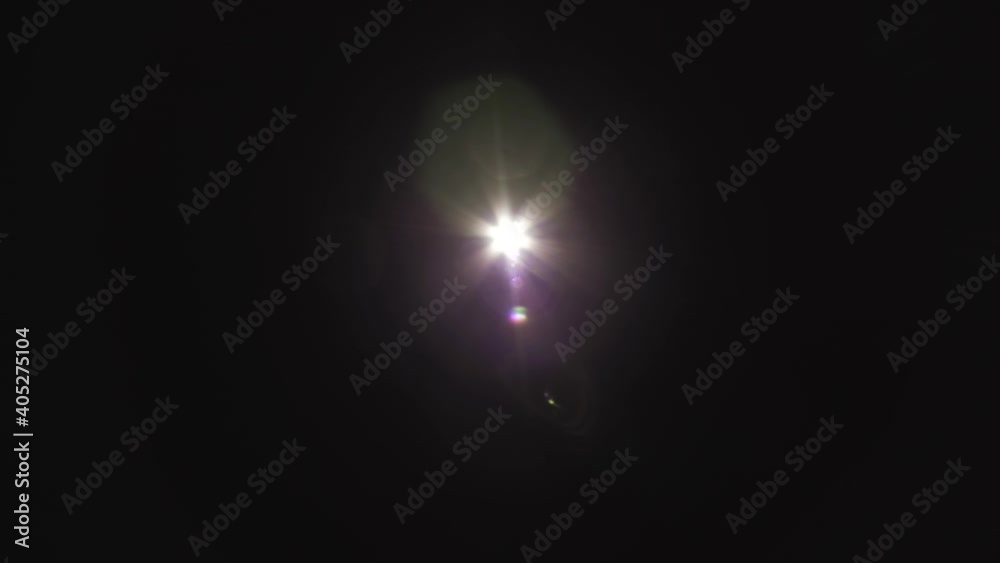 Flare of light or sun on dark black background Flare of light or sun on dark black background