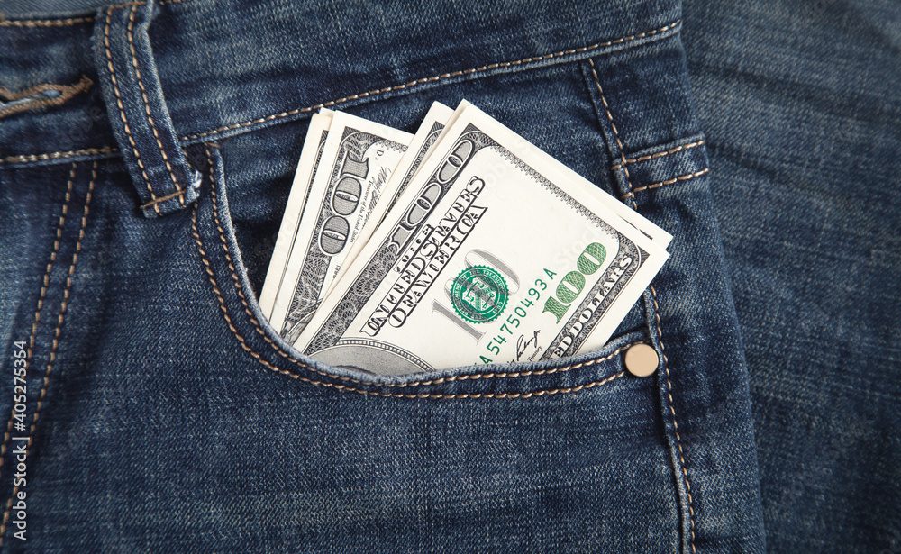 Dollar banknotes in jeans pocket. Dollar banknotes in jeans pocket.