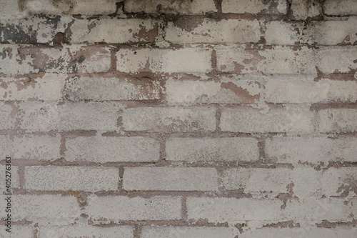 Dirty brick wall with broken and weathered surface, background or template with space for text, no person