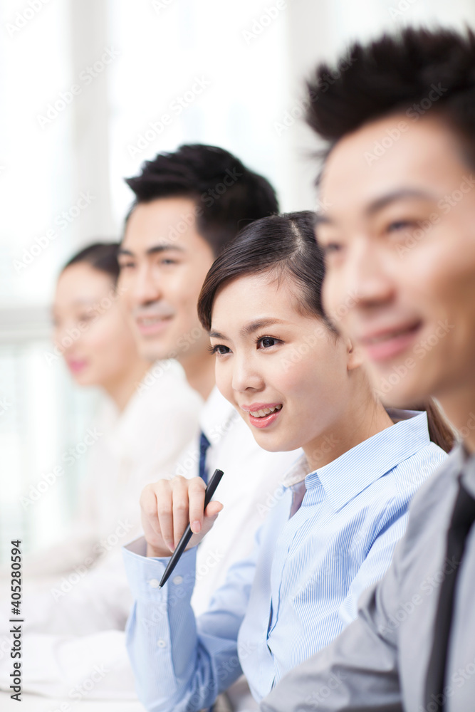 Group of business people sitting at conference table Group of business people sitting at conference table