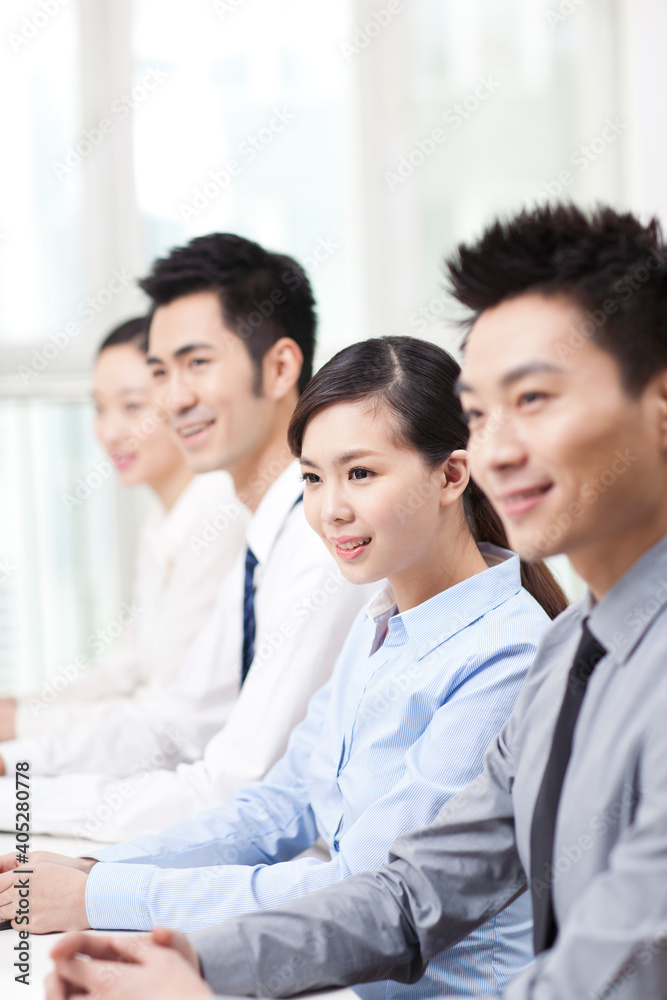 Group of business people sitting at conference table Group of business people sitting at conference table