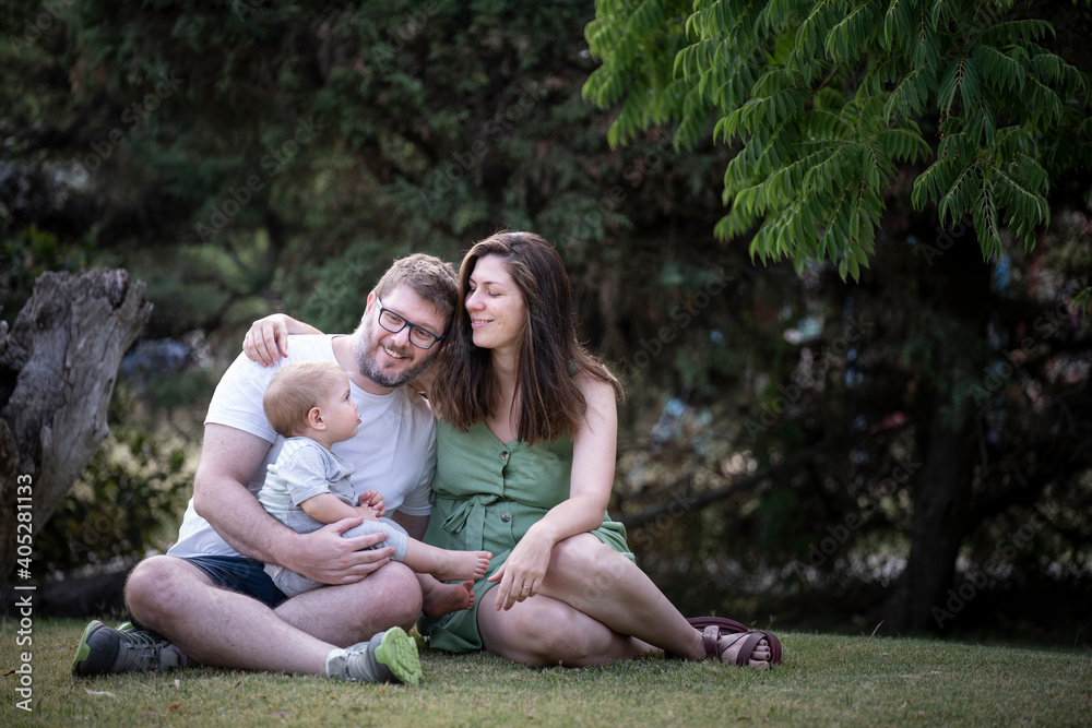 Fototapeta premium family portrait on a summer afternoon in the park