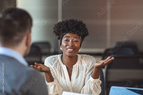Photography Beautiful female employee in suit is smiling during the job interview