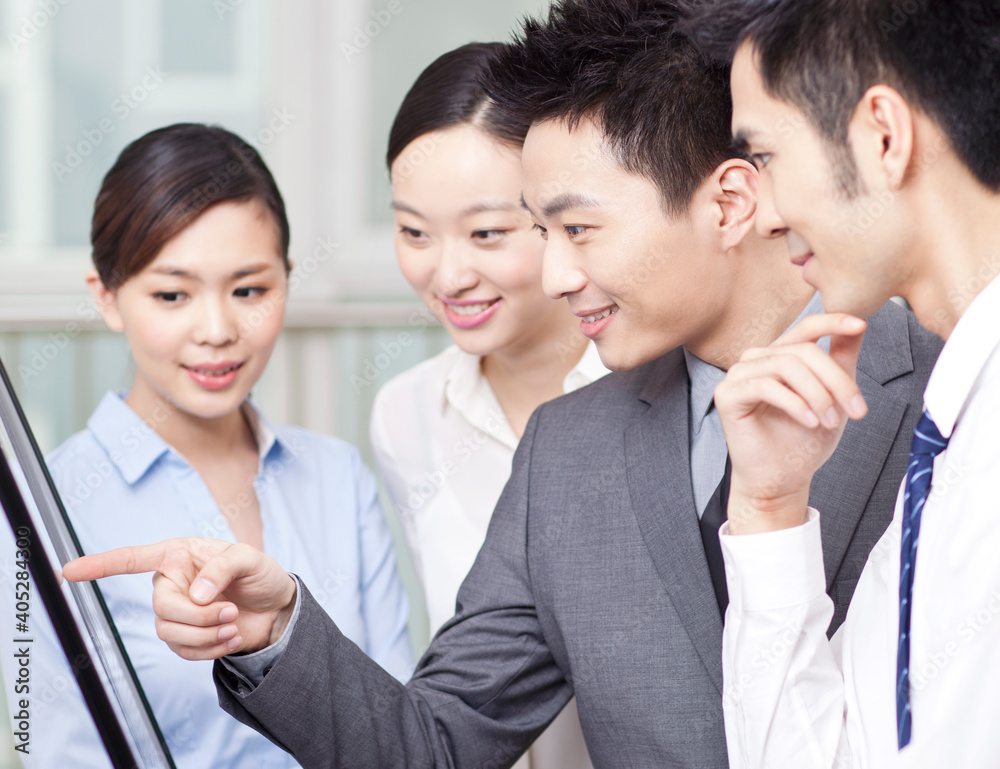 Group of business people discussing in office Group of business people discussing in office