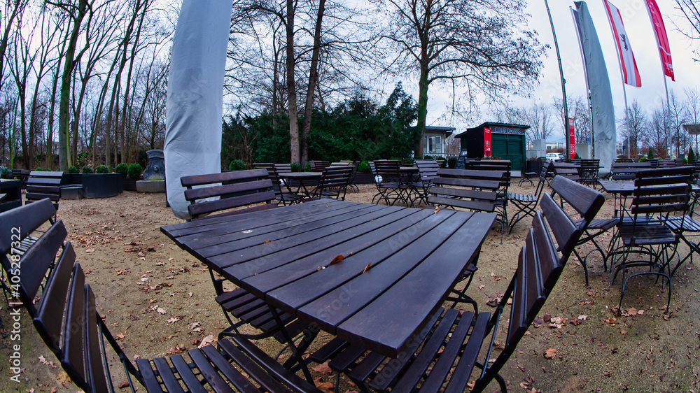 Empty tables in a beer garden due to the Corona crisis