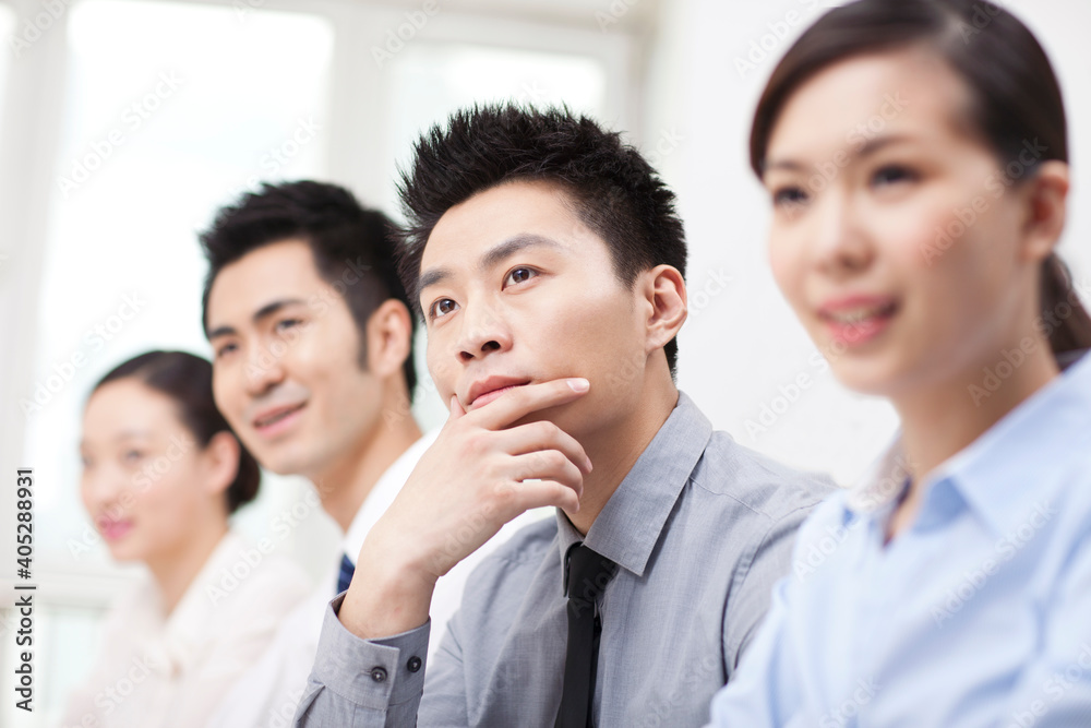 Group of business people sitting at conference table Group of business people sitting at conference table