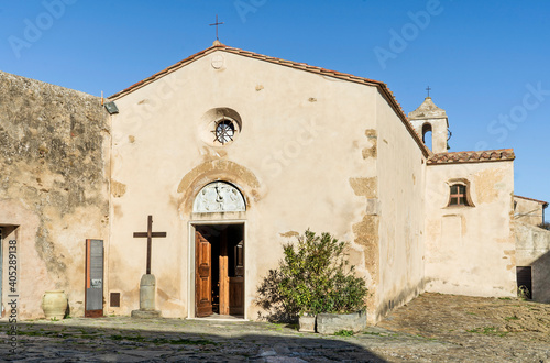 The tiny church of Santa Croce, built between 11th and 12th century in Romanesque style, in Populonia, municipality of Piombino, Tuscany, Italy.  photo