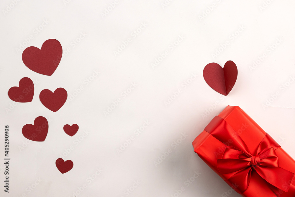 Red gift box on beige background, valentine's day gift, special occasion