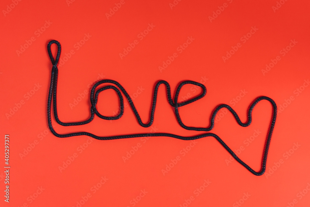 Flat lay of word love on bright red background. Flat lay of word love on bright red background.