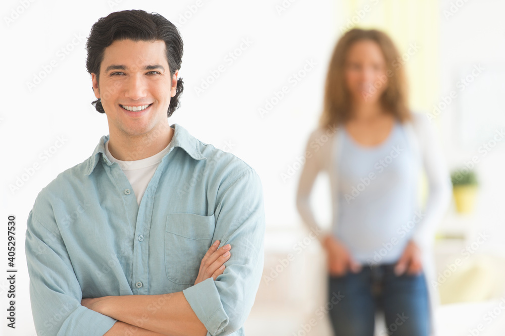 Portrait of couple with focus on man in foreground Portrait of couple with focus on man in foreground