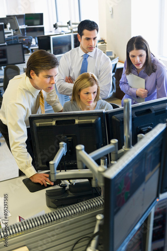 Traders at trading desk photo