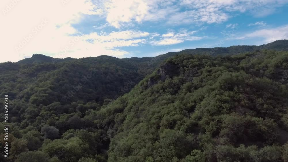 The drone flies over a dense rainforest and a mountain range. Aerial photography. Fly Over Forest with Beautiful sky Cinematic footage. The drone flies over a dense rainforest and a mountain range. Aerial photography. Fly Over Forest with Beautiful sky Cinematic footage.