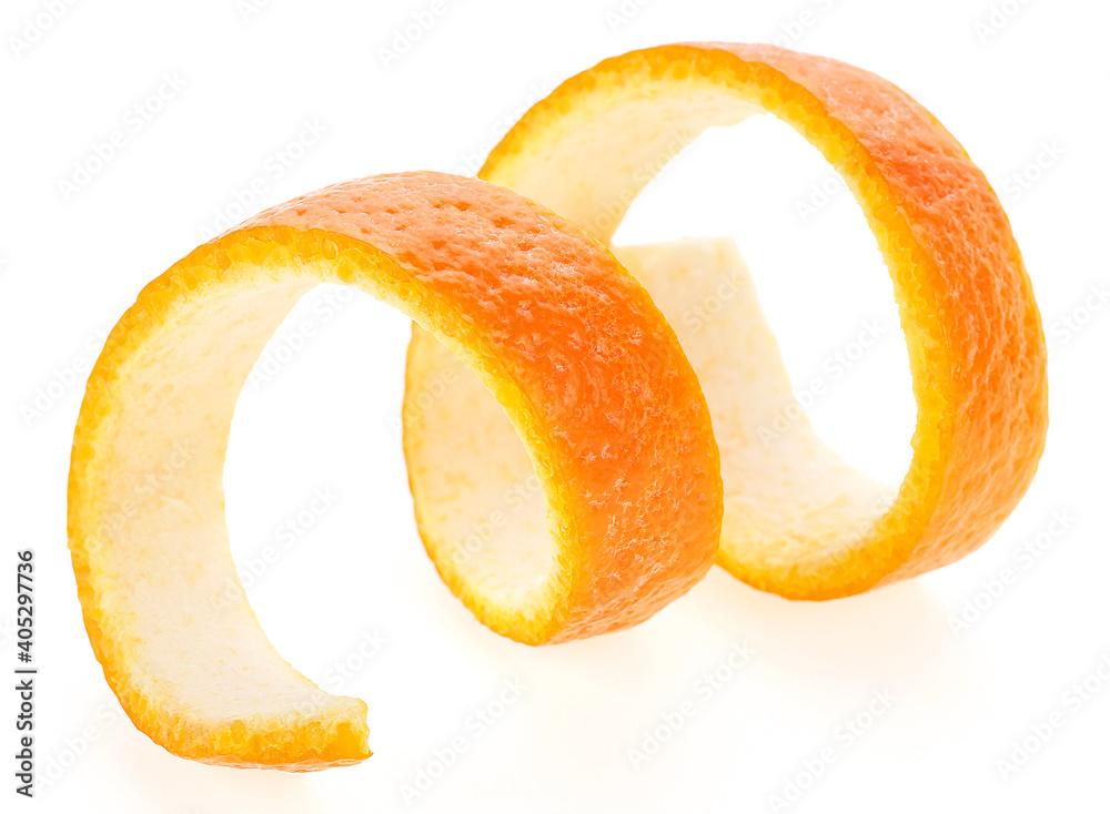 Cocktail decoration - peeled orange isolated on a white background. Spiral skin of orange fruit, selective focus. Cocktail decoration - peeled orange isolated on a white background. Spiral skin of orange fruit, selective focus.