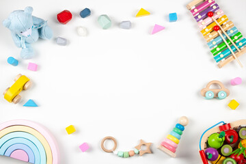 Baby kids toys frame on white background. Top view. Flat lay. Copy space for text