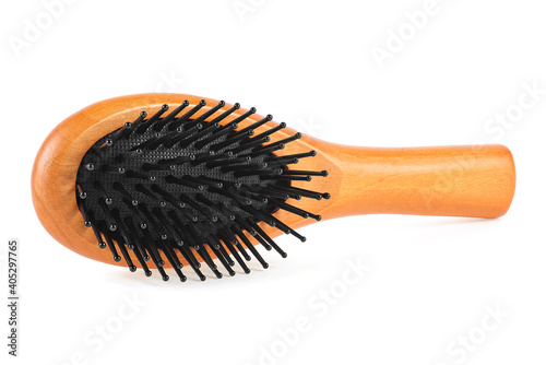 Wooden comb brush isolated on a white background