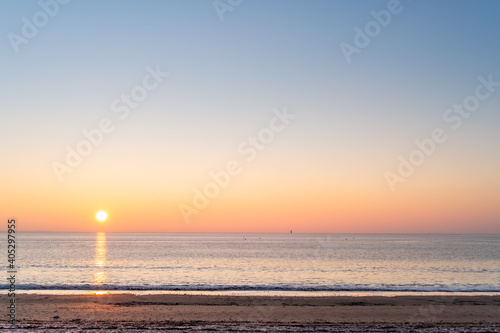 Panorama of Re island seascape with a little lighthouse in the horizon at sunrise on a very calm sea. beautiful minimalist seascape.