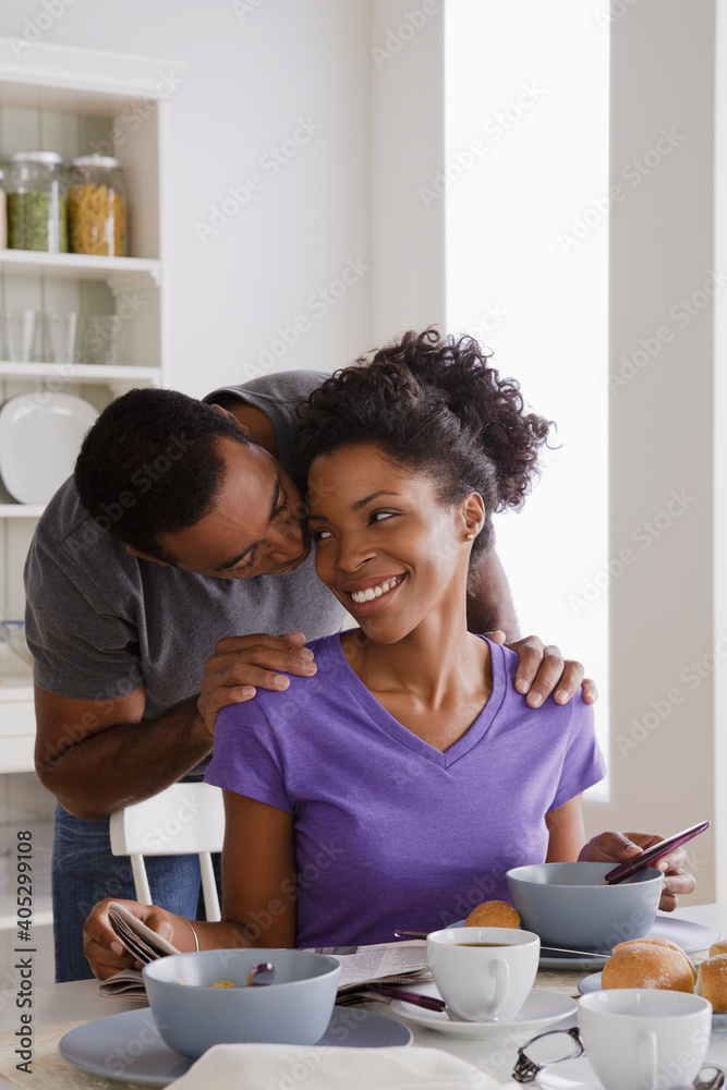 Smiling couple having breakfast together Smiling couple having breakfast together