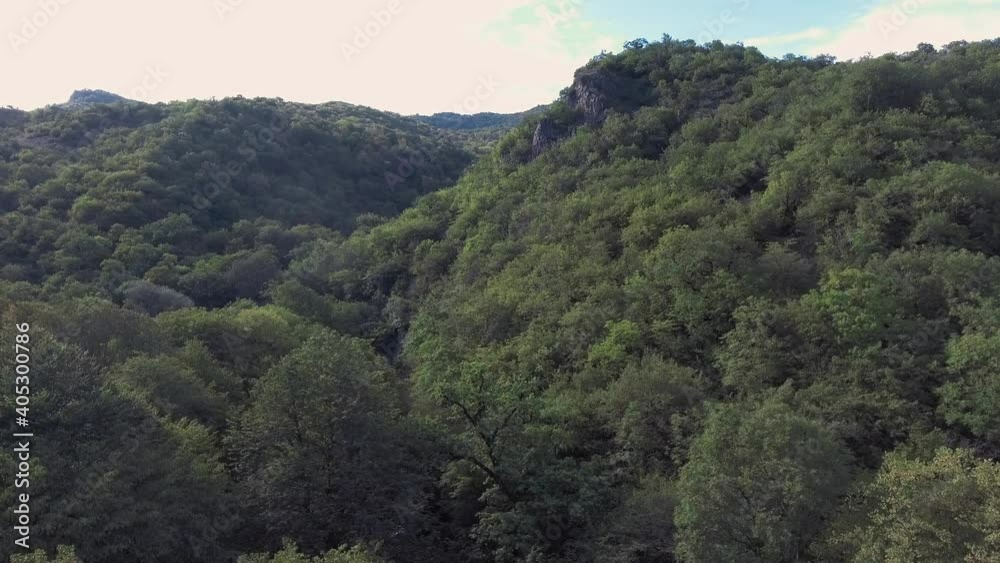 The drone flies over a dense rainforest and a mountain range. Aerial photography. Fly Over Forest with Beautiful sky Cinematic footage. The drone flies over a dense rainforest and a mountain range. Aerial photography. Fly Over Forest with Beautiful sky Cinematic footage.