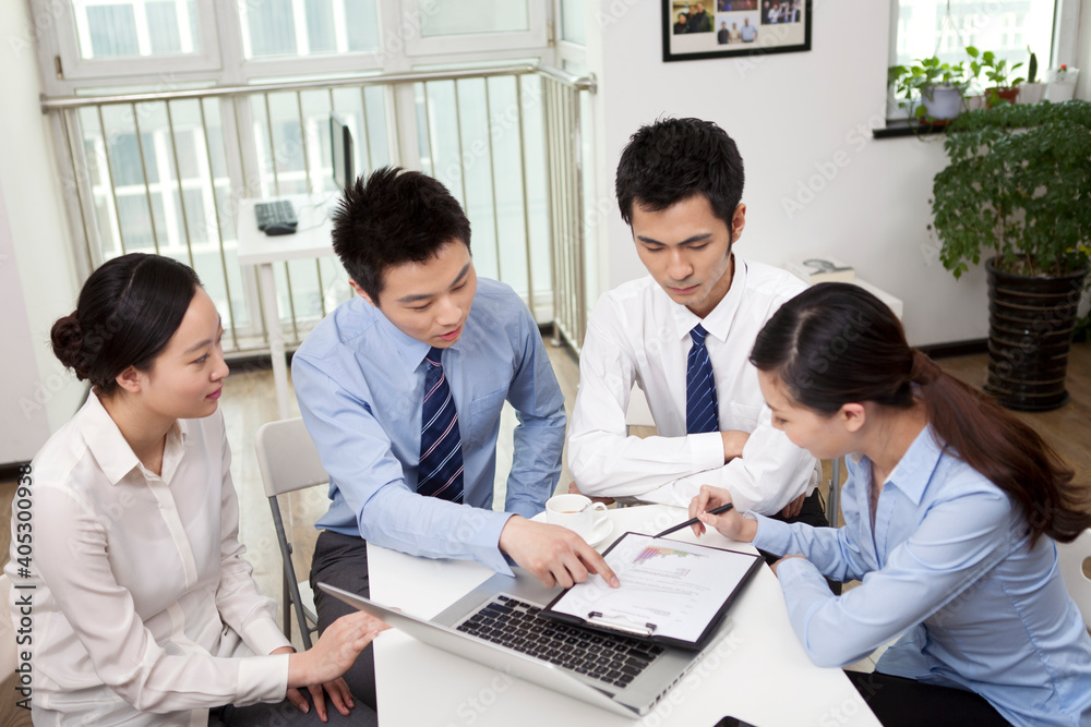 Group of business people discussing in office Group of business people discussing in office