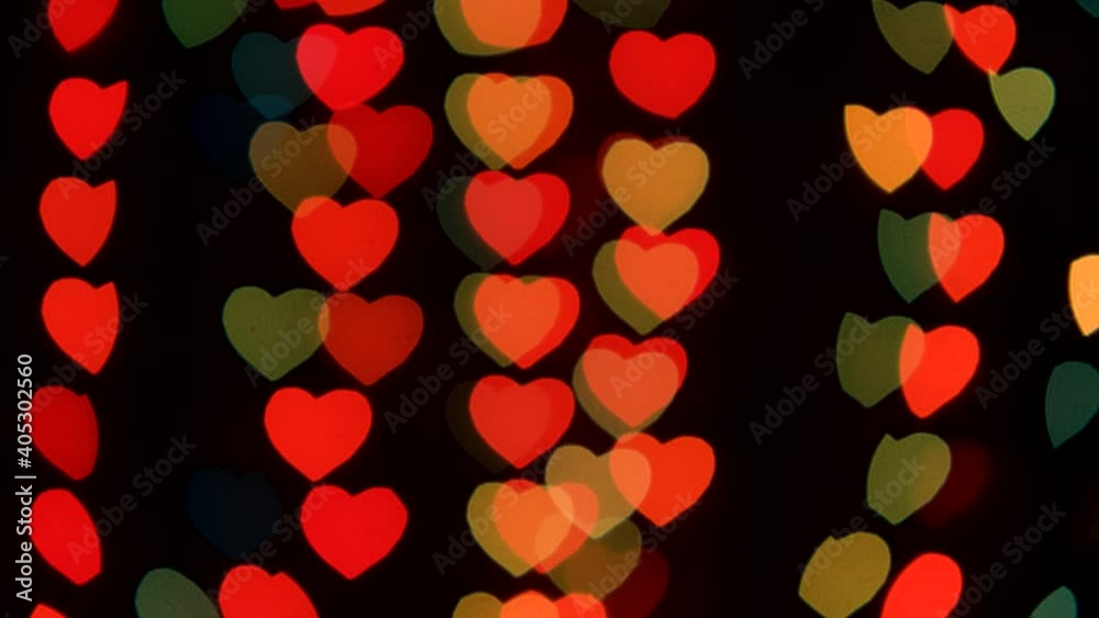 Vertical optical distortions on the background of bokeh in the form of hearts. Vintage background. Valentine's Day Vertical optical distortions on the background of bokeh in the form of hearts. Vintage background. Valentine's Day