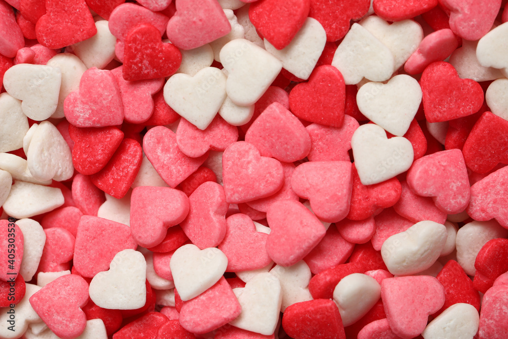 Sweet candy hearts as background, top view Sweet candy hearts as background, top view