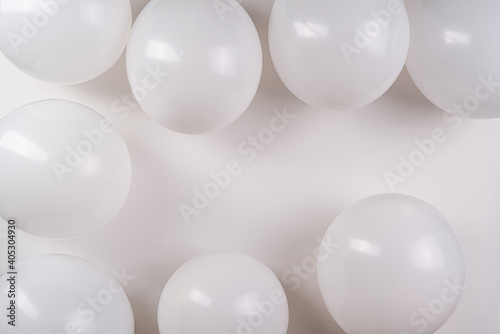 White balloons on white background with copy space.Wedding or greeting card.
