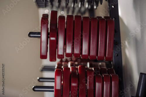 Close-up photo of stand with dumbbells.