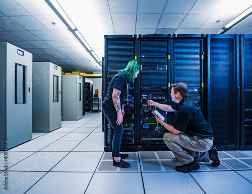 Co-workers in data center server room