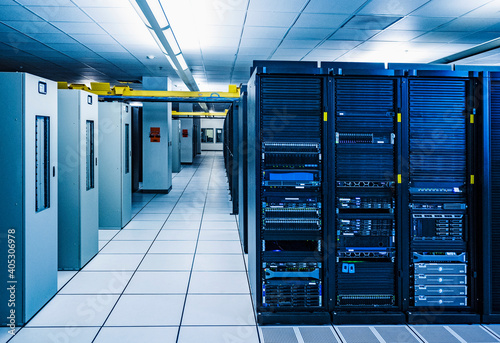 Rows of server racks in data center photo