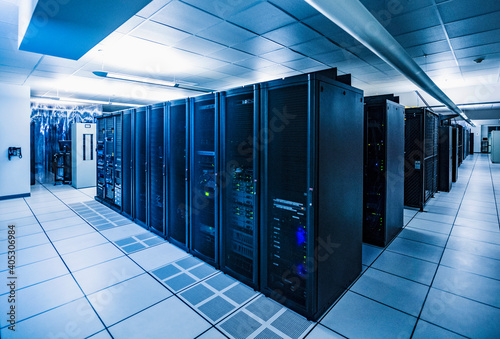 Rows of server racks in data center photo