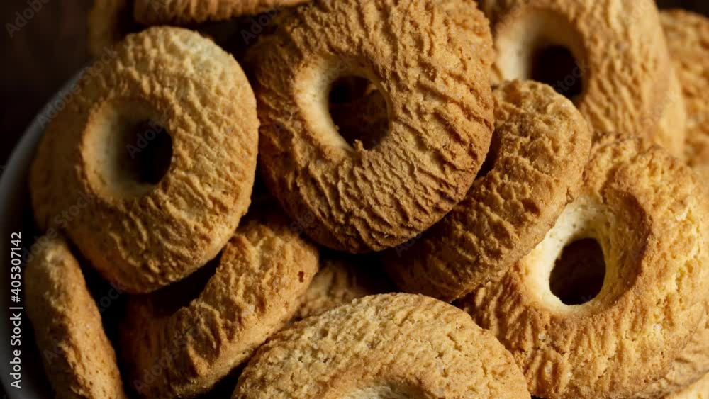 Ring Coconut biscuits served on a bowl. Brazilian little donuts. Selective focus in a top view.