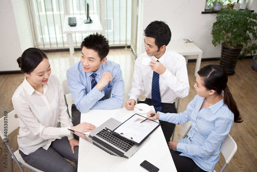 Group of business people discussing in office Group of business people discussing in office