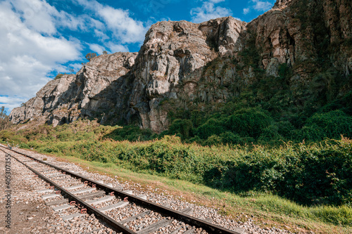 Old Railway with rocky mountains and stone walls on a sunny day in Suesca, Cundinamarca - Colombia