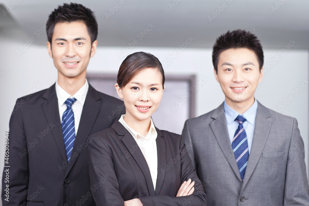 Four young office workers with hands crossed indoors,portrait Four young office workers with hands crossed indoors,portrait