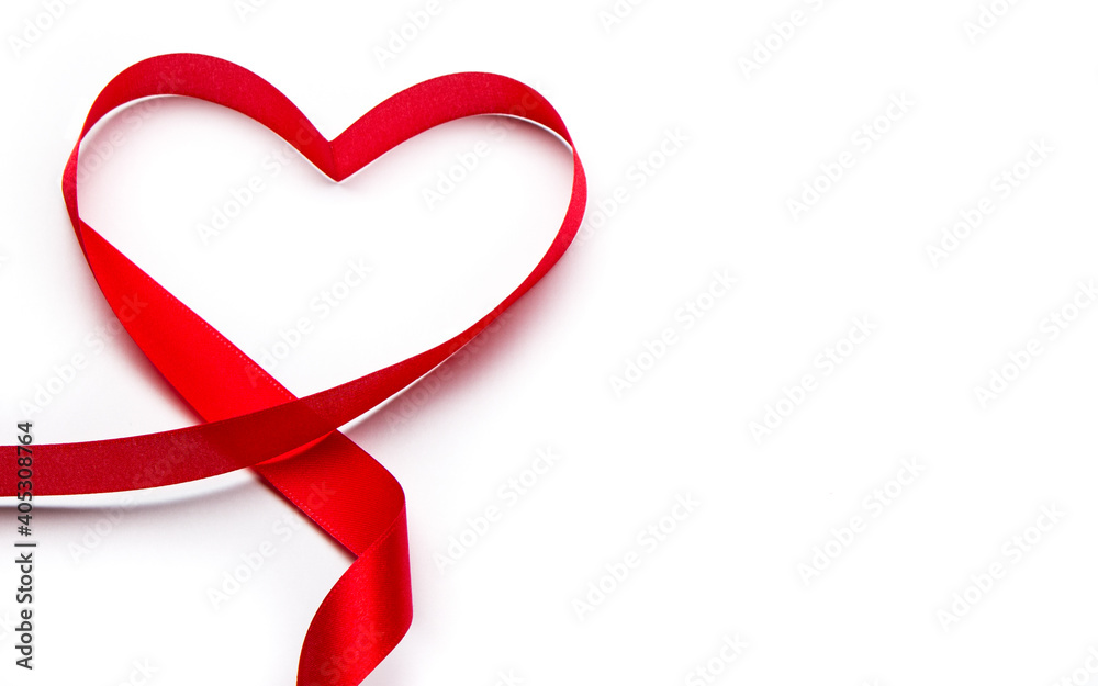 Valentines day greeting card. Heart made of red ribbon. February 14 Saint Valentine's Day. Love symbol. White isolated background with copy space. Valentines day greeting card. Heart made of red ribbon. February 14 Saint Valentine's Day. Love symbol. White isolated background with copy space.