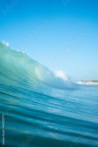 Breaking Waves and spray, white water and light reflected on the surface of the water