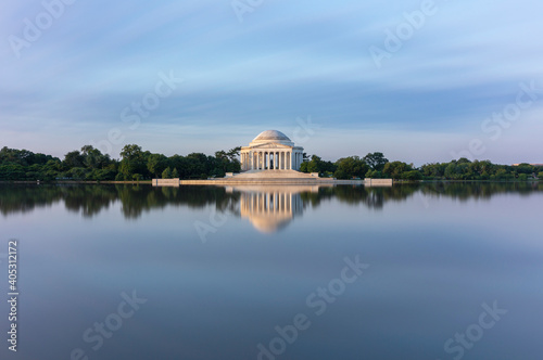 USA, Washington DC, Jefferson Memorial reflecting in Tidal Basin at dawn photo